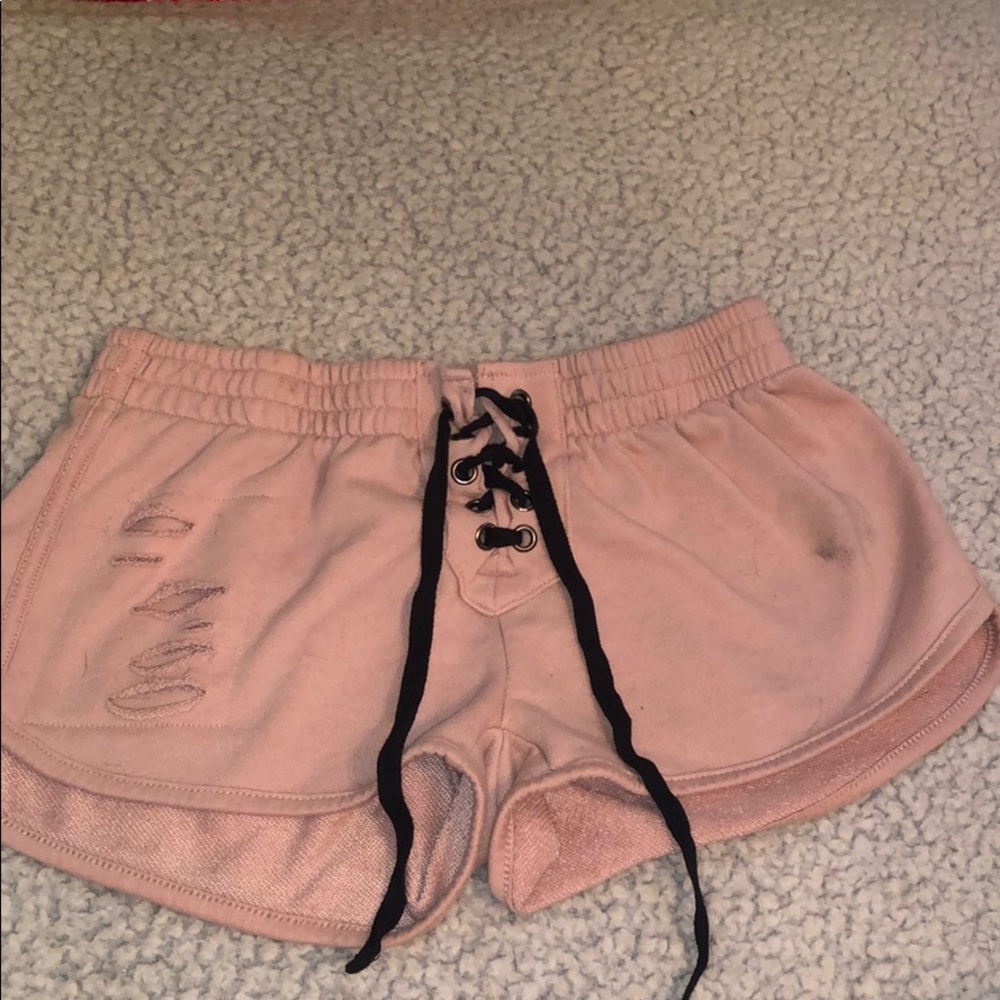 Pink torn shorts